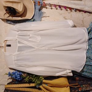 Sheer white tunic.